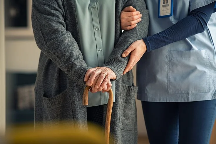 Nurse helping an elderly